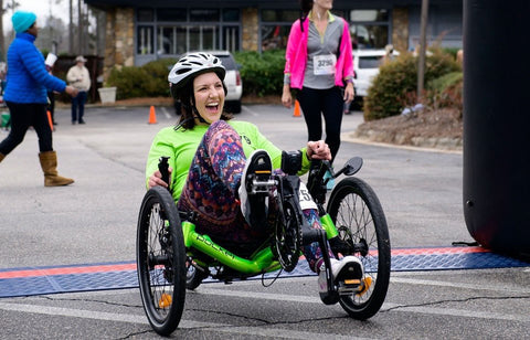 Andrea Peet, triker, on her green Catrike Pocket.