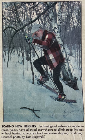Man Snowshoeing Uphill Newspaper Article Image