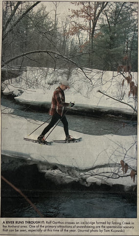 Man Snowshoeing Newspaper Article Image