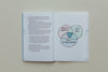 Open book with text and illustrated venn diagram