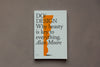 White book cover on grey background, with title DESIGN and illustration of orange key paper-cut