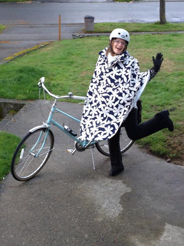 Victoria with her HappyRainyDays Rain Cape available at Le Vélo Victoria