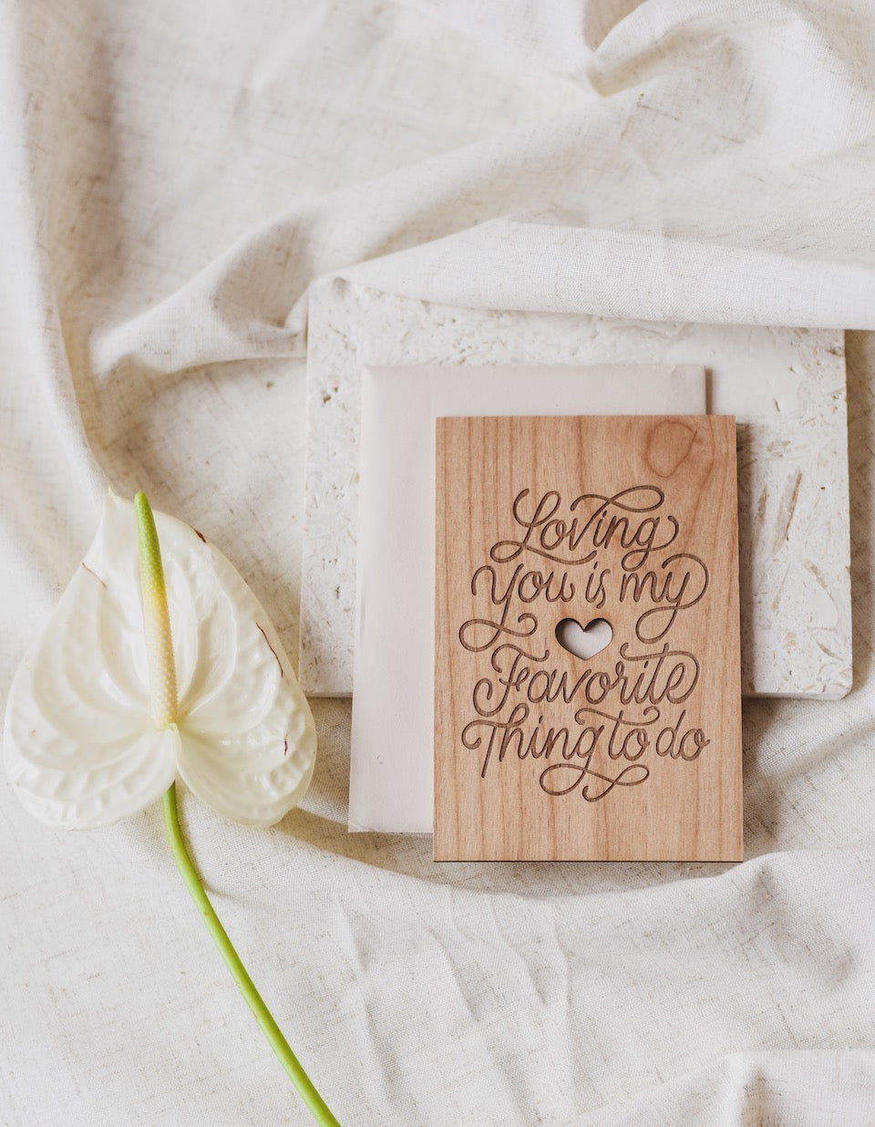 engraved wooden card in script