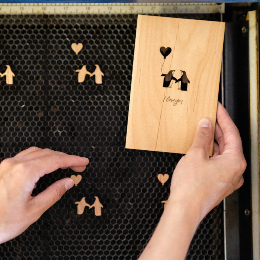 Hand holding a wooden card