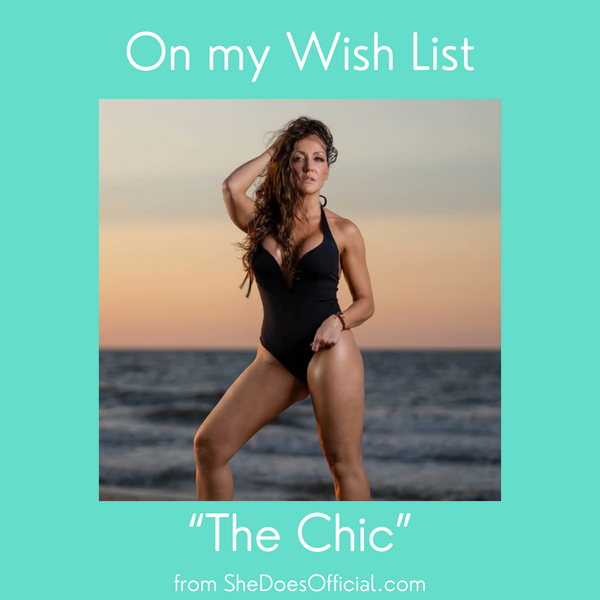 The Chic, a stunning, black, deep-v one-piece from swimwear designer SheDoes, modeled by the CEO herself