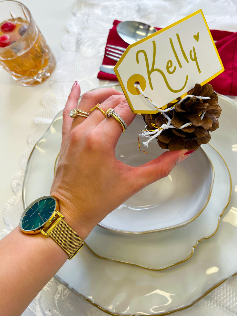 Use holiday themed place settings, with the sunburst green & gold watch