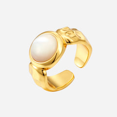 sea side ring. Gold adjustable ring with a mother of pearl round center feature