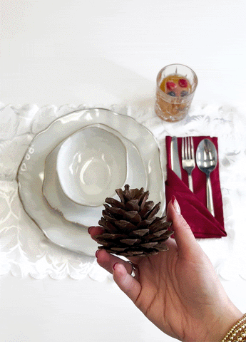 Use gift tags and some holiday themed decor to make name cards for table settings