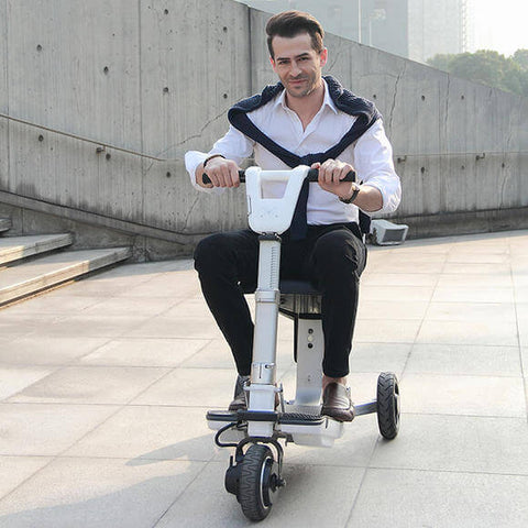 Man ridig an electric mobility scooter