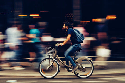 Man riding electric bike in the middle of the street