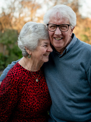 elderly man and woman smiling