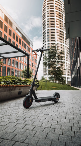 Electric scooter in front of two buildings