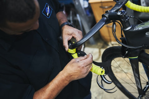 man fixing an electric bike