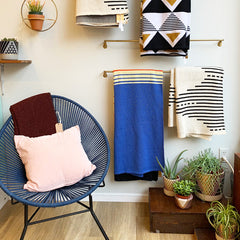 shop items displayed on the wall and on a chair
