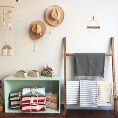 shop display of hats and blankets