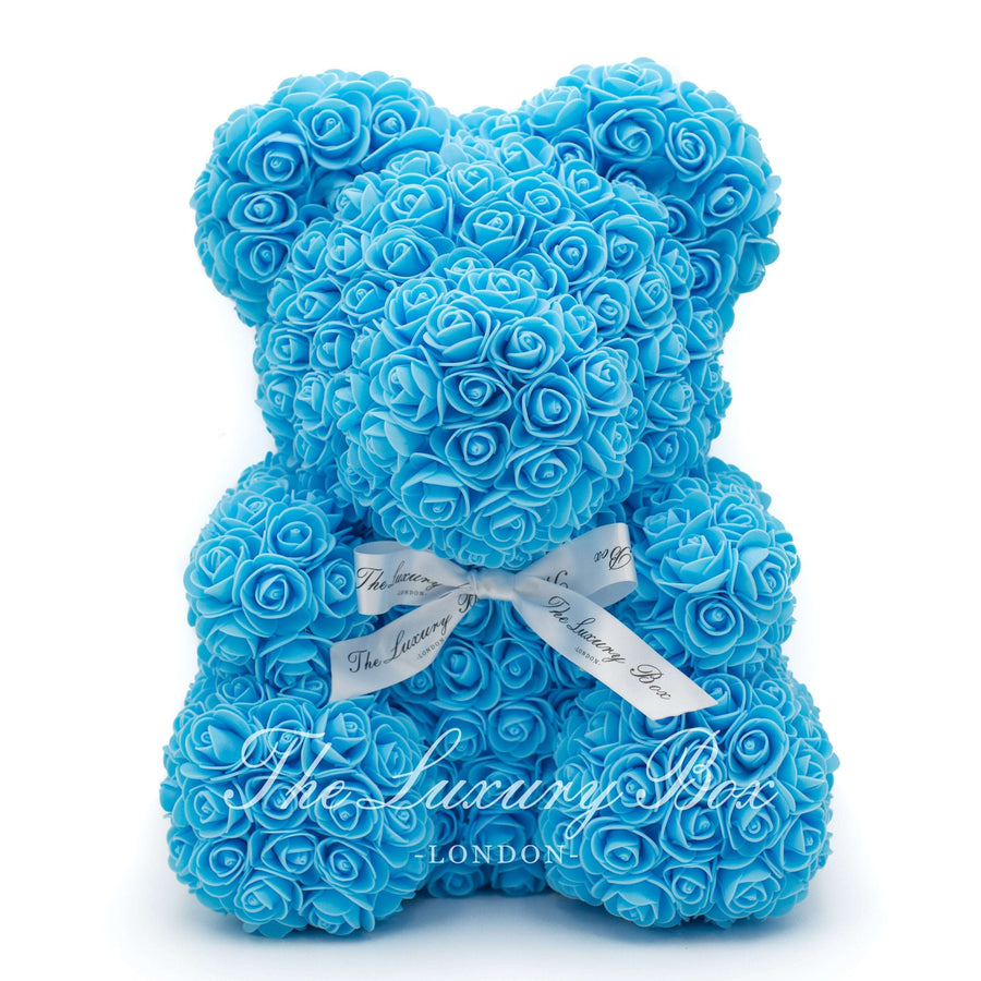 teddy bear with blue roses