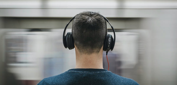 a man wearing noise canceling headphones