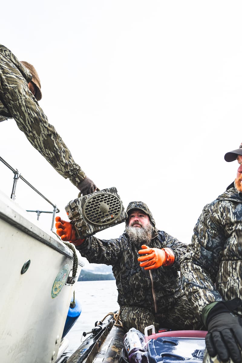 Rob Kinney with friends in a boat