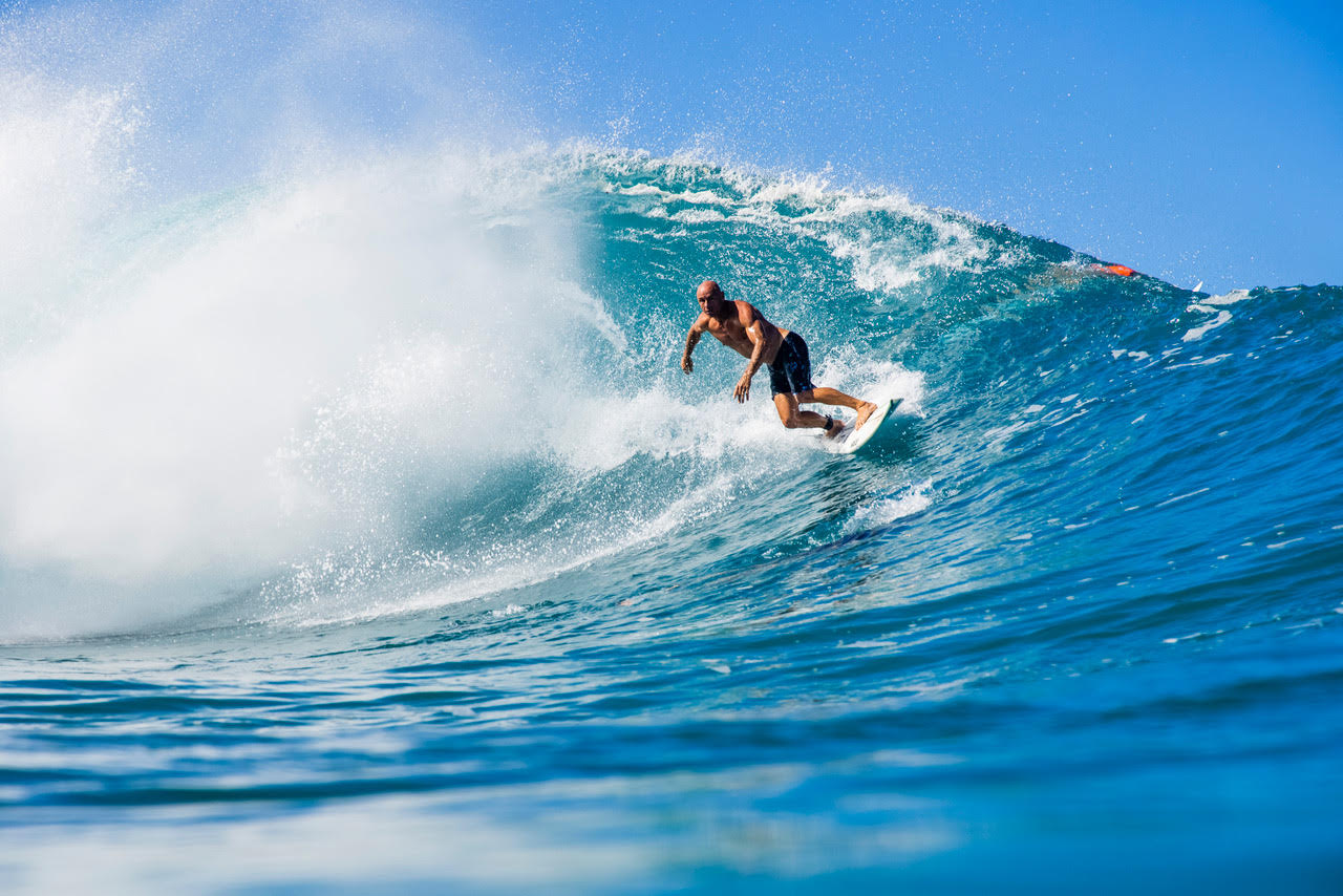 Shane Dorian surfing a big wave.