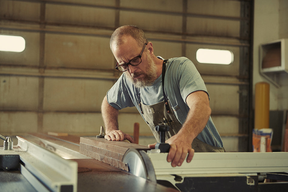 Todd McCollester in his Artifact Woodworking Apron Using an Altendorf Sliding Panel Saw