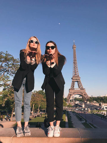 girls standing on the footpath