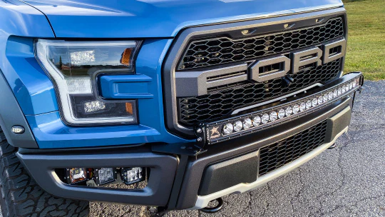 blue ford truck with light bar