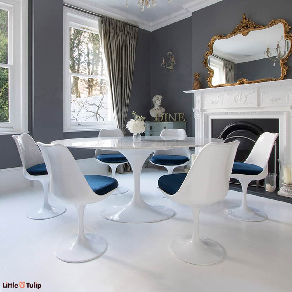 Edwardian dining room with marble Tulip Table and 6 Tulip chairs with blue cushions