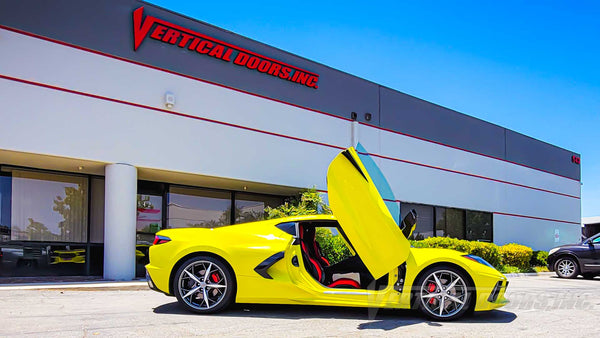PhotoQuest Studio’s Accelerate Yellow C8 Corvette with Lambo Doors Kit installed by Vertical Doors, Inc.