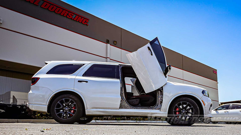 Check out the @thehellrango Dodge Durango from Illinois showing off a lambo door kit by Vertical Doors, Inc.