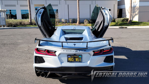 Silver Flare Chevrolet Corvette C8 from California featuring vertical lambo door conversion kit by Vertical Doors, Inc.
