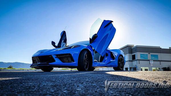 Rapid Blue Chevrolet Corvette C8 from California featuring vertical lambo door conversion kit by Vertical Doors, Inc.