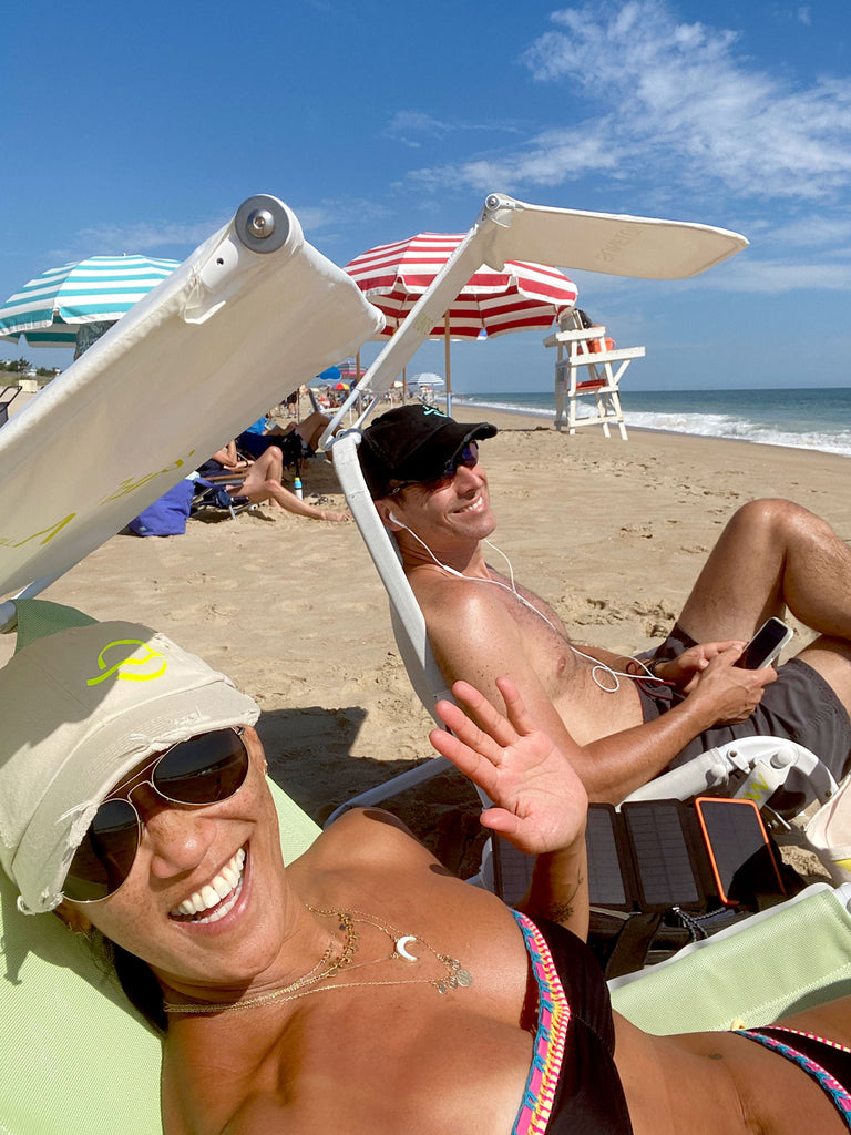 Leslie + Greg, founders, on the beach in their SUNFLOW chairs