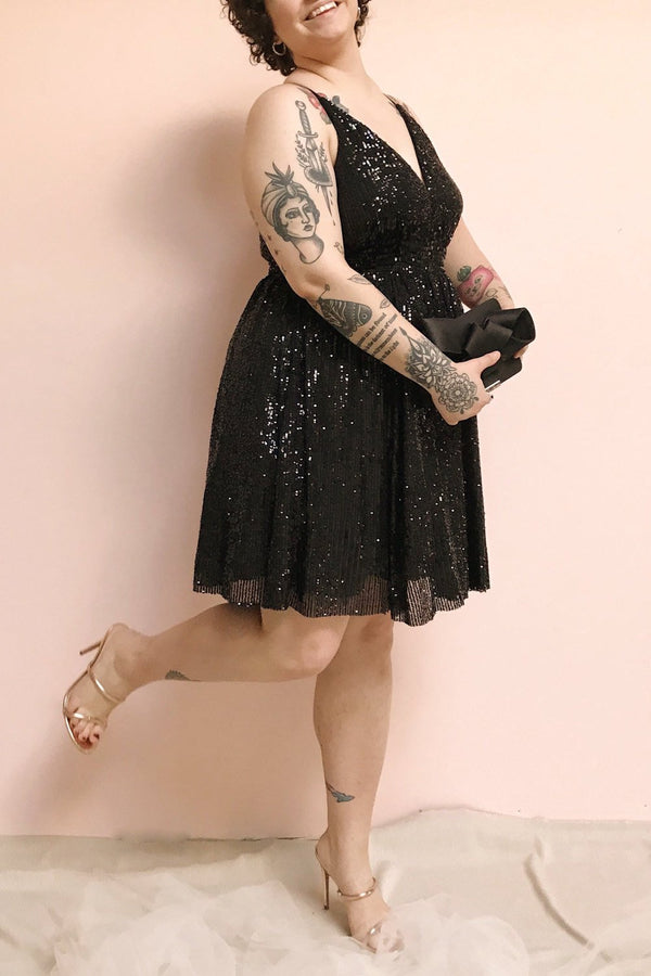 black dress and rose gold shoes
