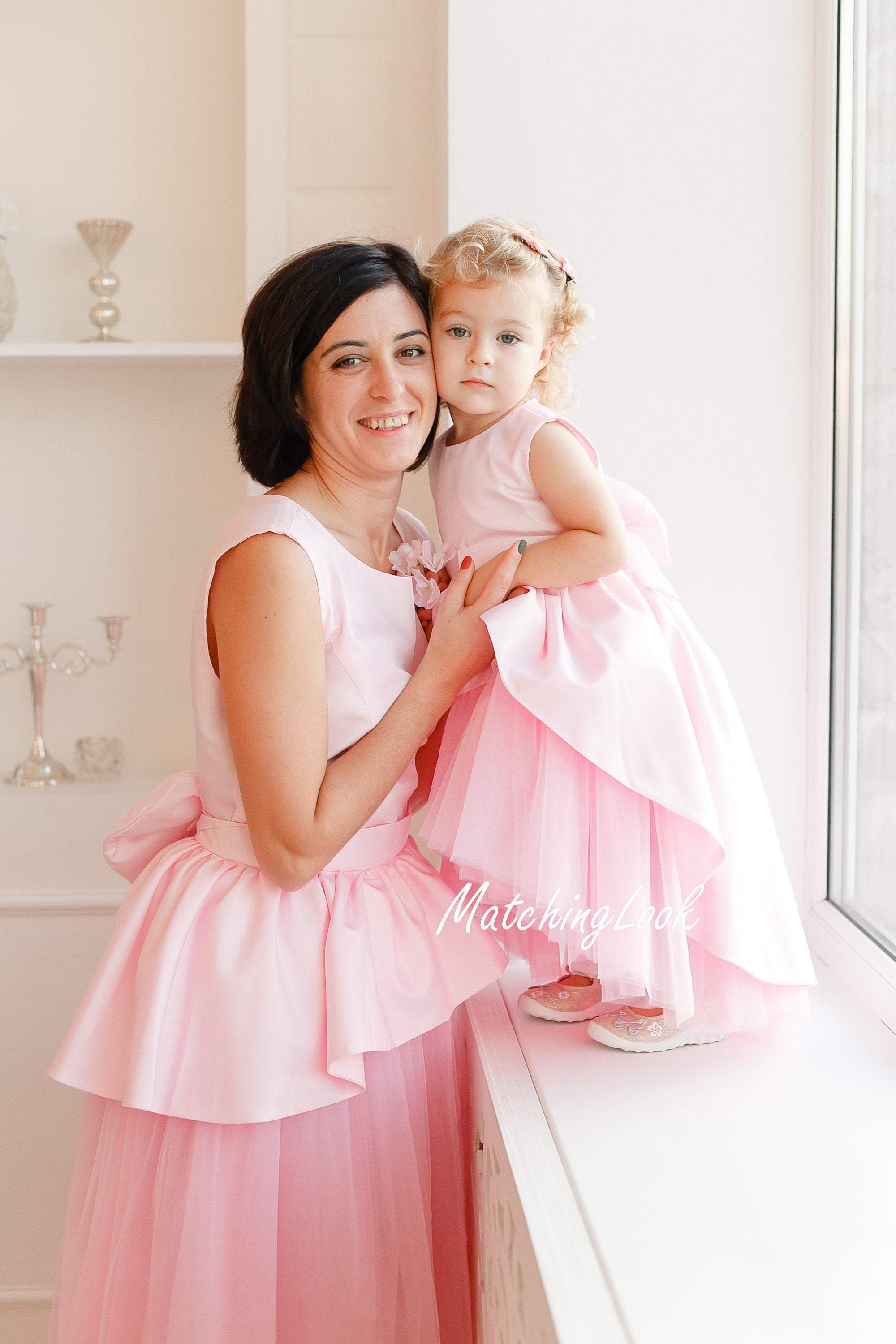 Twinning dresses in baby pink color for mother daughter