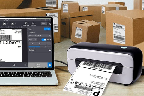 a laptop and a shipping label printer