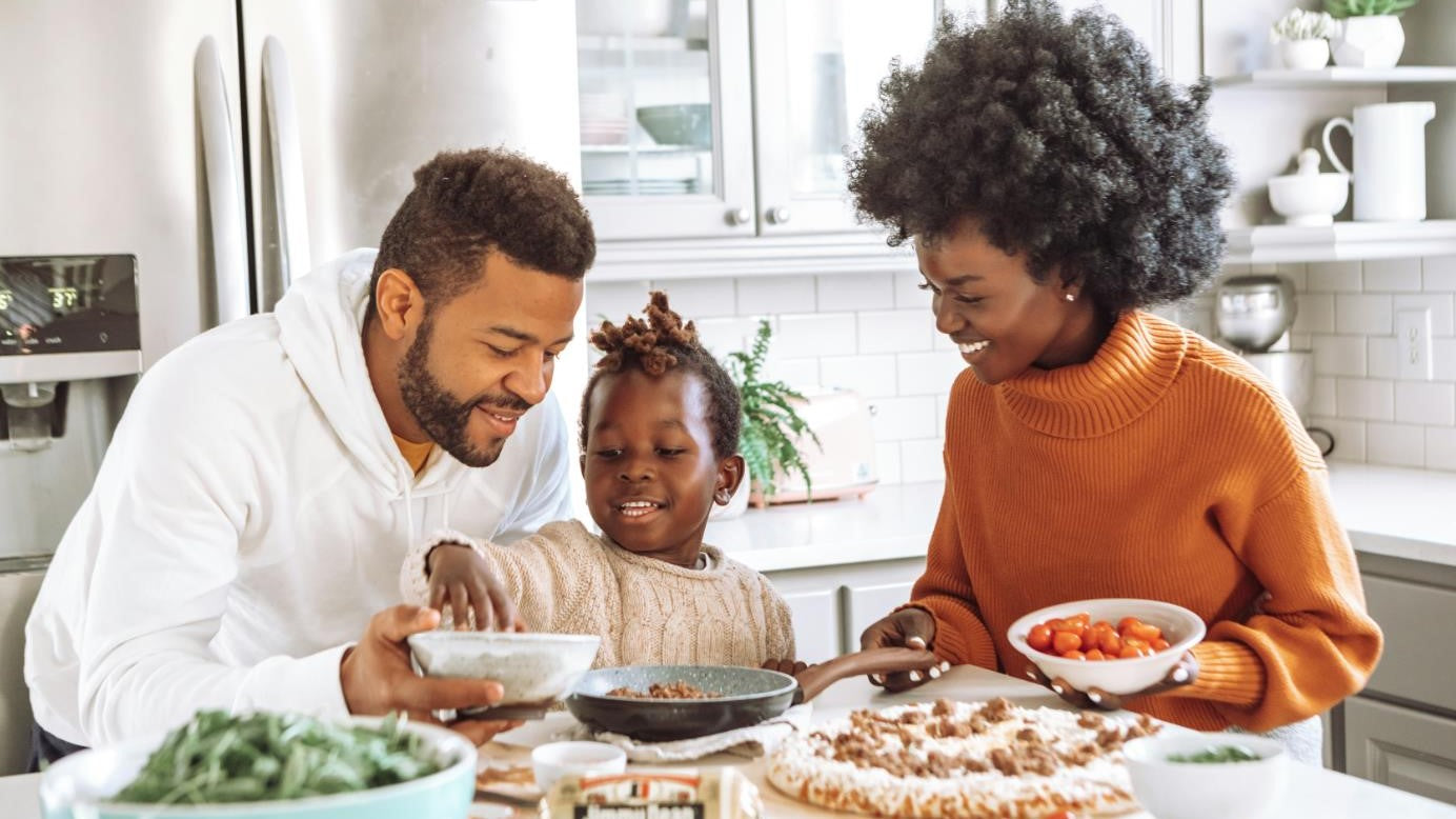 A happy family enjoy the meal together