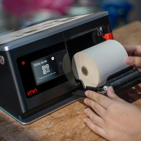 Person Changing the Roll of Thermal paper