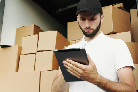 a man using ipad when deliver goods