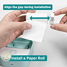 The second step to use Phomemo T02 sticker printer is install a paper roll, align the gap during installation.