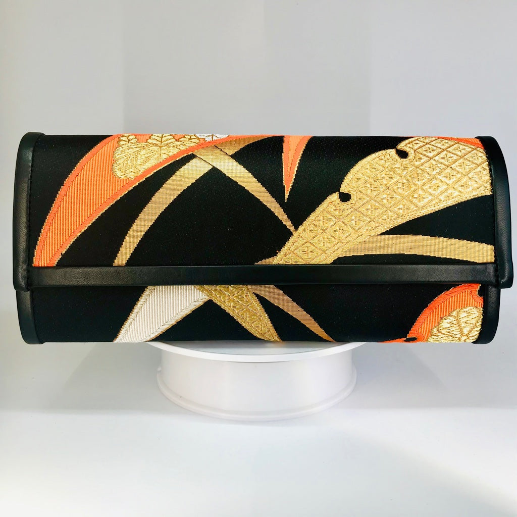 orange and gold clutch bag