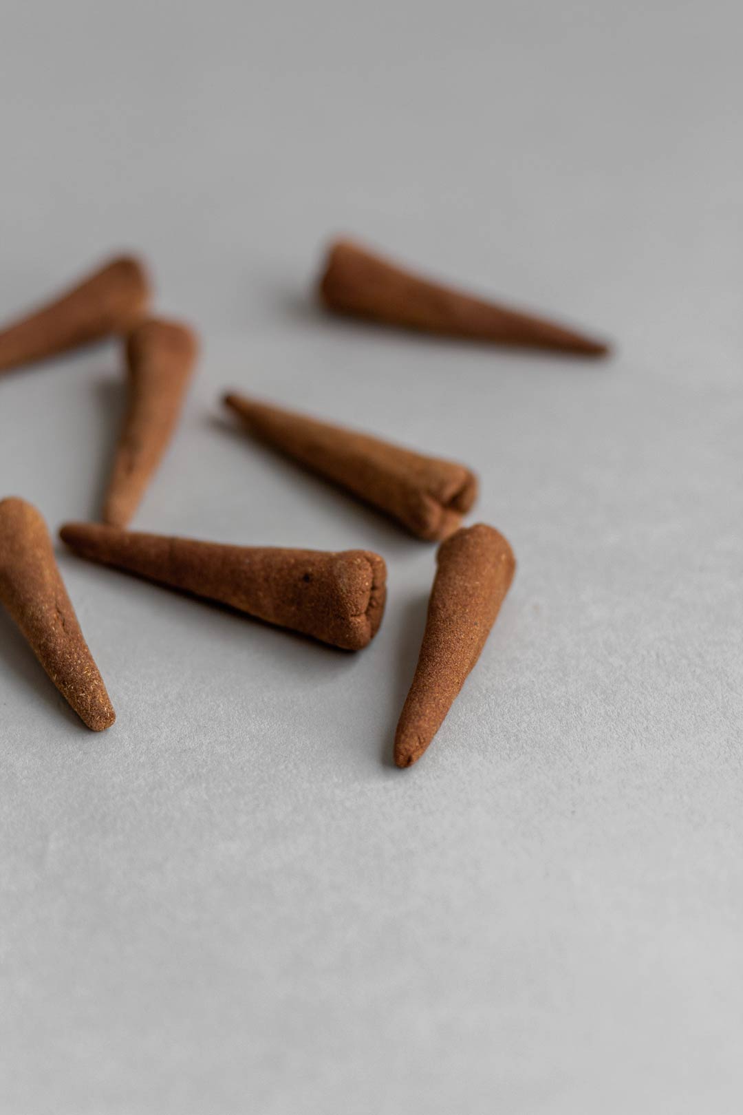 Handcrafted hana-koh cone incense made with rose petals, sandalwood and patchouli.