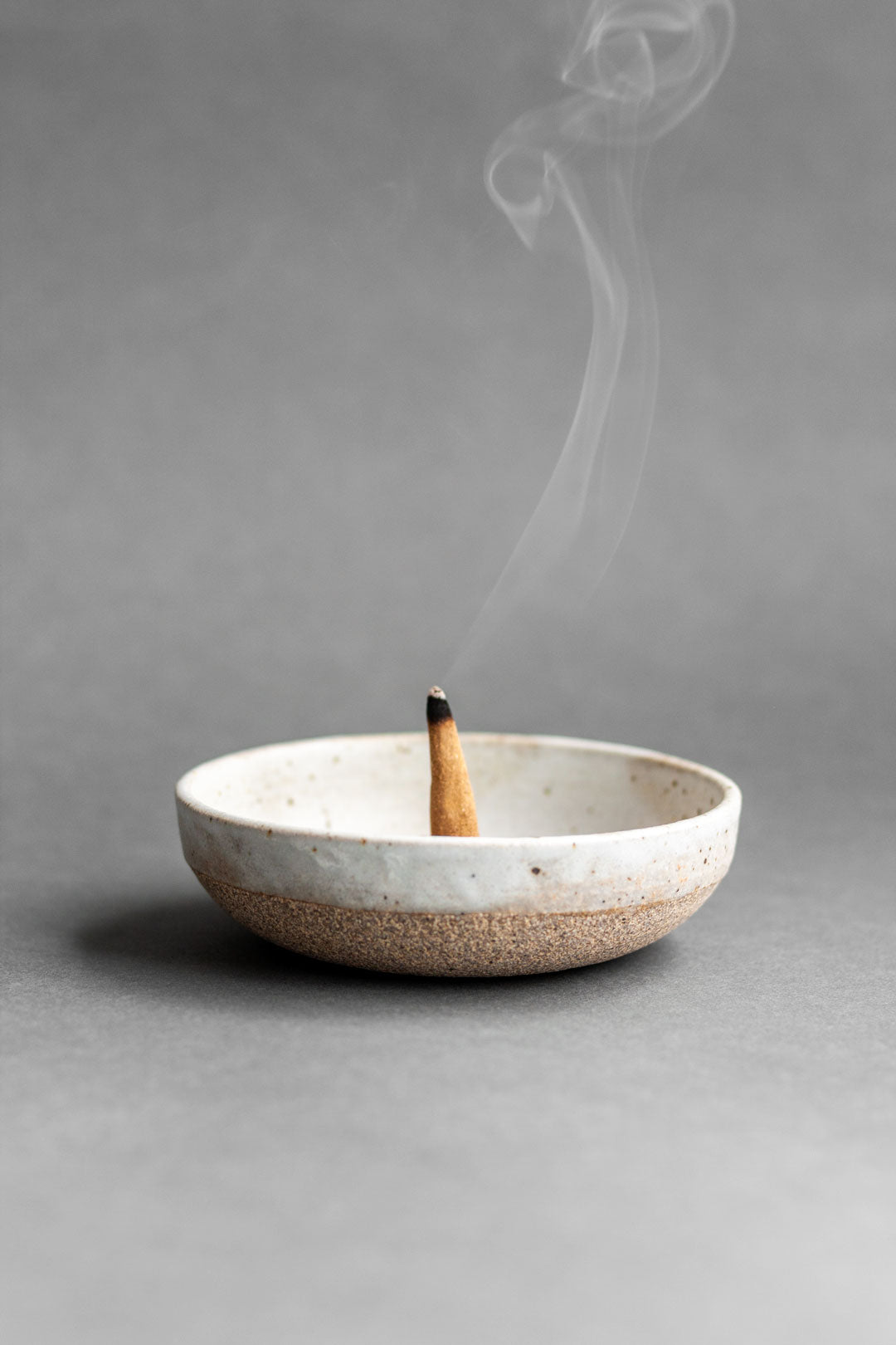Hana-koh incense burning on a Colleen Hennessey ceramic dish.