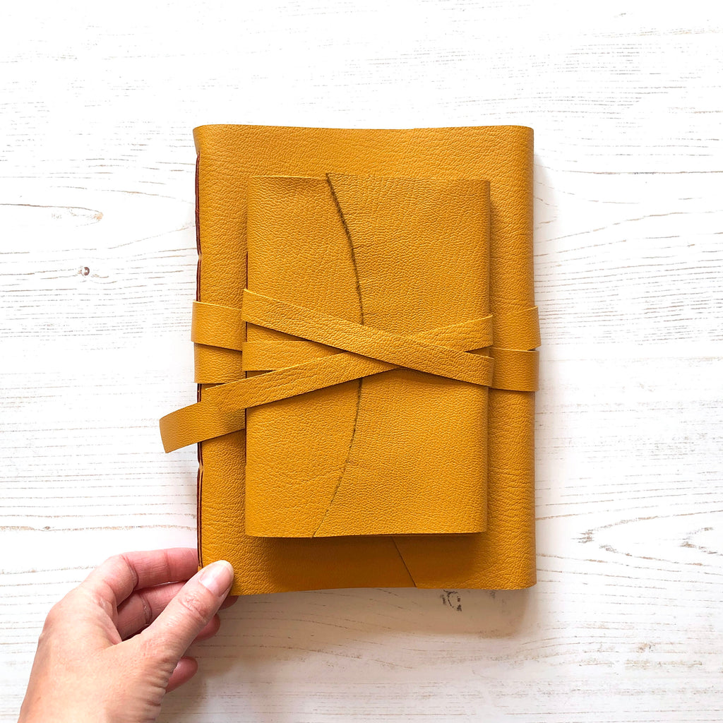 Mustard Yellow A5 and A6 leather journals bound by hand by Dorset bookbinder Susan Green