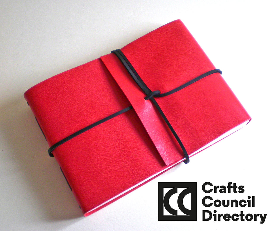 Red and black leather book handmade by Crafts Council Directory member bookbinder Susan Green of BOUND