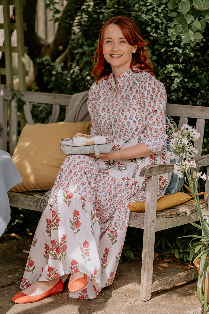 Dorset bookbinder Susan Green holds wedding guest books and artists' sketchbooks in the garden outside her creative studio