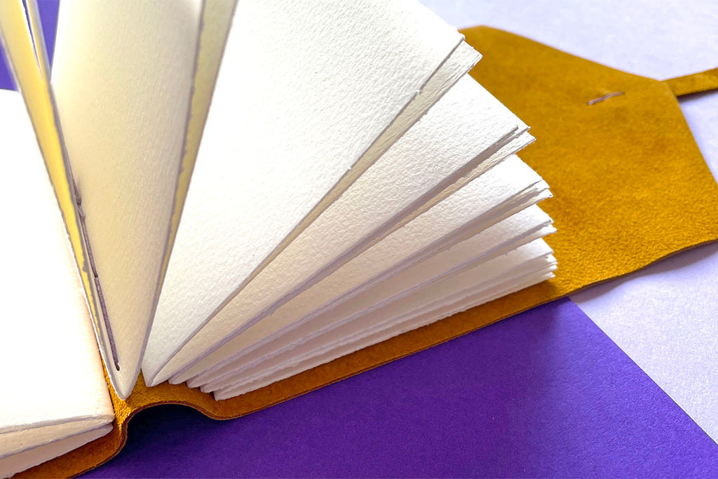 Leather Watercolour Sketchbook bound by hand in Mustard Yellow and Lilac with 300gsm cold pressed pages