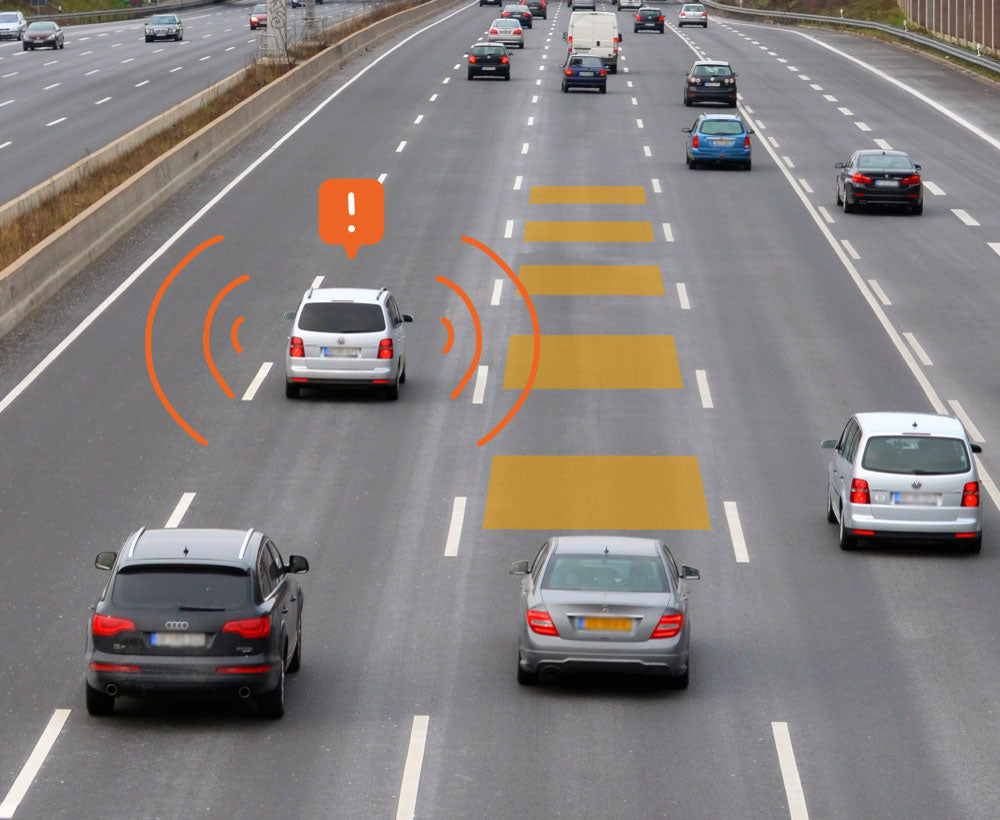 Cars driving down a freeway with lines demontrating blind spot detectors giving off False alerts for Radar Detectors