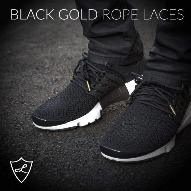 black shoelaces with gold tips