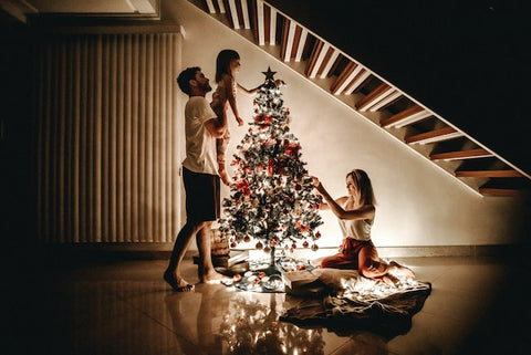 family and christmas tree