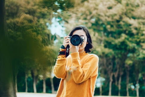 woman holding a camera